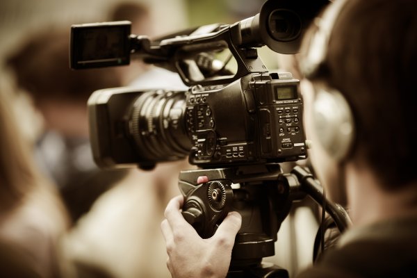 video editing software man shooting filming camera